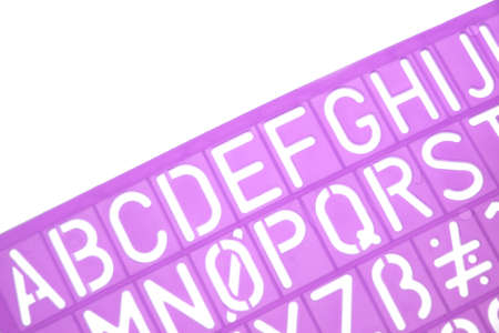 English Letters Plastic Stencils Alphabet Isolated on White Backgroundの写真素材