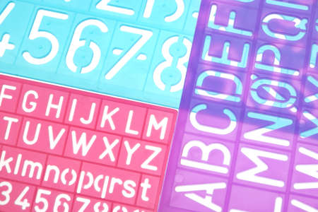 English Letters Plastic Stencils Alphabet Isolated on White Backgroundの写真素材