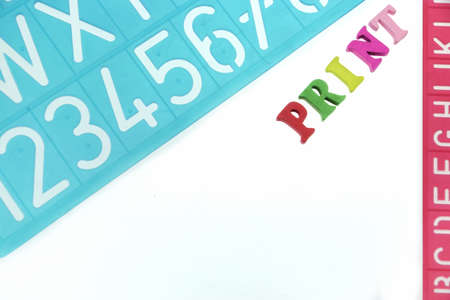 English Letters Plastic Stencils Alphabet Isolated on White Backgroundの写真素材