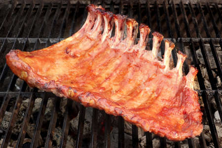 BBQ Baby Back Spicy Marinated And Smoked Pork Ribs On The Hot Charcoal Grill. Good Snack For Outdoor...