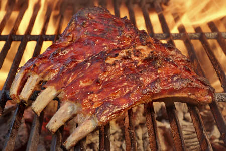Tasty Smoked Pork Spare Ribs On The Hot Flaming  Barbecue Charcoal Grillの写真素材
