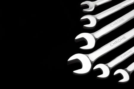 Copy Space With Group Of  Six Fork Wrenches Isolated On Black Backgroundの写真素材