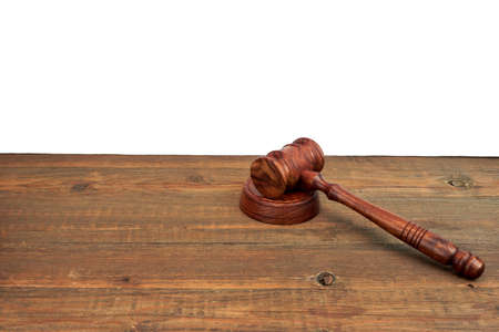 Judges Or Auctioneers Wood Rough Desk With Gavel On The Sound Board Isolated On White Background With Copy Space. Judicial System Conceptの写真素材