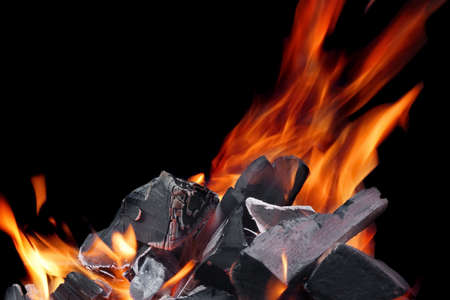 Hot Glowing Charcoal With Bright Flames Isolated On The Black Background Closeupの写真素材
