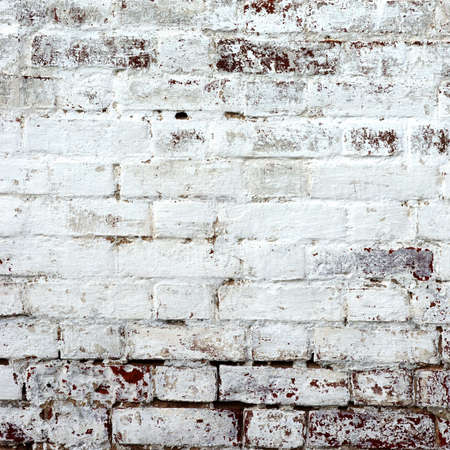 Red Brick Wall With Damaged White  Plaster Frame Background Texture Close Upの写真素材