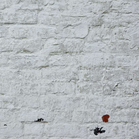 Old Rustic White Brick Wall With Whitewash Painted  Plaster layer Frame Background Texture Close Upの写真素材
