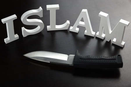 White Sign ISLAM (Islamic State of Iraq and the Levant) Made From Wood Letter And Military Knife On...