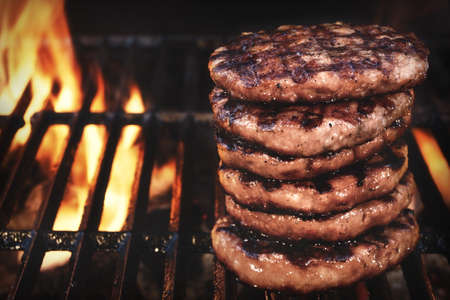BBQ Grilled Burgers Patties On The Hot Flaming Charcoal Grill, Top View. Cookout Food, Good Snack For Outdoor Party Or Picnicの写真素材