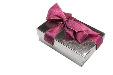 One Silver Gift Box Tied With Big Purple Bow Isolated On White Background, Close-up, Top Viewの写真素材