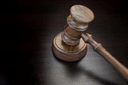 Judges Or Auctioneer Gavel On Black Wood Grunge Background, Top View, Close-Up.