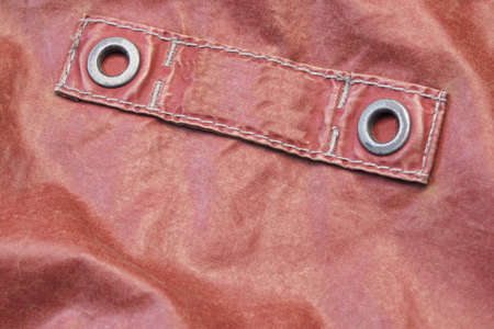 Red Modern Leather Jacket Fragment With Empty Label, Close Up, Background With Copy Spaceの写真素材