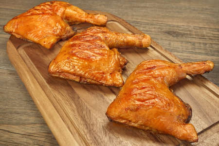 Three Grilled BBQ Crispy Chicken Leg Quarter On The Wood Board And Country Table In The Background,...