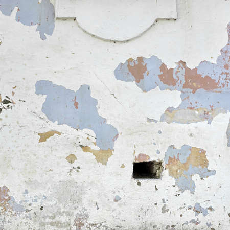 Decrepit White Peeled Plaster Wall With Cracked Structure Frame Blank Grunge Background. Dark Brick Mortar Old Wall With Shabby Stucco Isolated Square Texture. Renovation Concept. Blank Wreck Surfaceの写真素材
