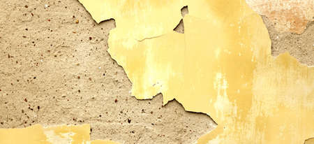 Dark Plaster Wall With Dirty Yellow Scratched Horizontal Background. Old Brickwall With Peel Swamp Color Stucco Texture. Retro Vintage Worn Wall Wallpaper. Decay Crack Rough Abstract Banner Surface.の写真素材