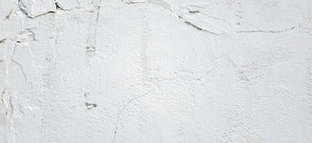 Aged White Brick Wall Wide Texture.  Distressed Whitewash Brickwall Empty Background. Grunge Gray Dirty Stonewall Surface. Dark White Grey Shabby Exterior Worn Wreck Wall. Abstract Horizontal Bannerの写真素材
