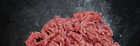 Raw Minced Meat On Black Vintage Background. Top View Of Fresh Ground Beef Isolated On Black...