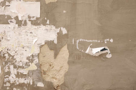 Old Billboard with Torn Posters. Dirty Street Wall with Crumpled, Wrinkled, Creased, Worn and Torn...