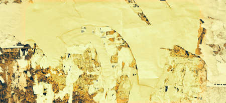 Grunge Wide Background with Old Torn Posters. Urban Graffiti Wall Texture. Grungy Ripped Wall with Torn Posters and Ads Background. Panoramic Urban Wallpaper. Graffiti Wall Texture.の写真素材