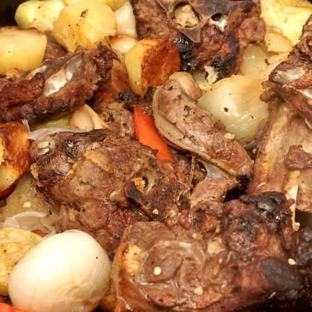 Traditional Stew From International Cuisine In Large Pot Coked From Meat And Vegetables With Herbs, Top View, Isolated. Meat And Vegetables Stewed In Bowl With Roasted Vegetables Closeup View.の写真素材