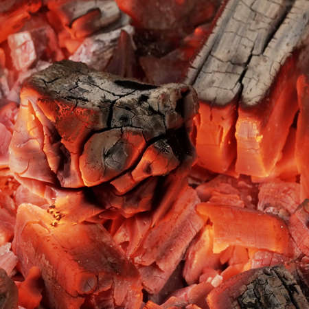 BBQ Grill Pit With Glowing And Flaming Hot Charcoal. Hot Charcoal In Barbecue Grill Pit With Flames...