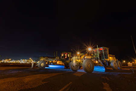 Bulldozer at nightの写真素材