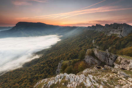 Clouds in the valley under Beriain peakの写真素材
