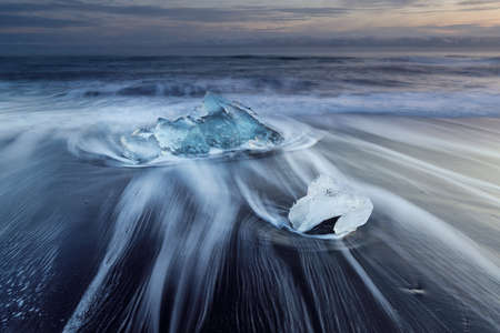 Diamond beach, ice blocks in a black sand beach