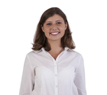 Portrait of happy business female against white backgroundの写真素材