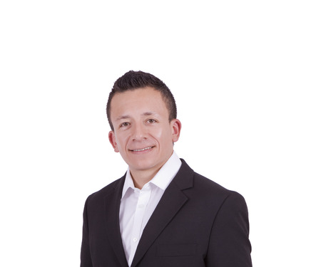 Close-up portrait of a young businessman posing against whiteの写真素材