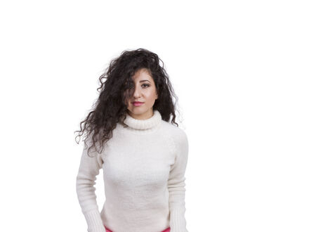 Portrait of a gorgeous female fashion model posing against white backgroundの写真素材