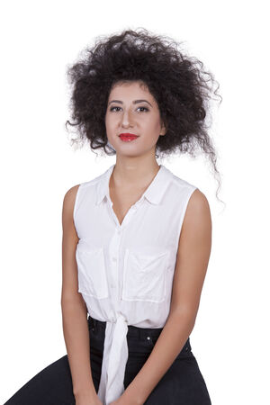 Portrait of a gorgeous young female posing against white backgroundの写真素材