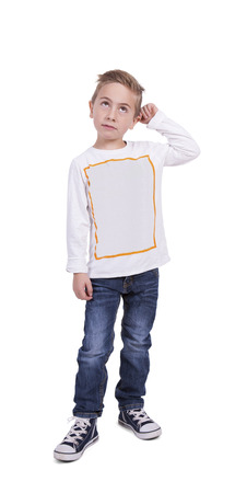 Image of a cute elementary boy lost in thoughtsの写真素材