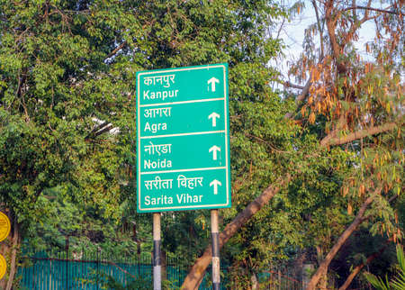 Sign Board In Green Showing Distance Of Towns Shaheen Bagh Abul Fazal Enclave And Okhla Village...