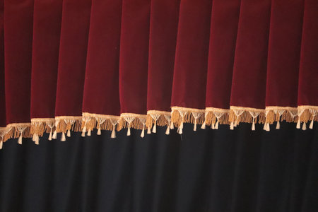 Red velvet curtain, closeup of photo. Red velvet curtain backgroundの写真素材