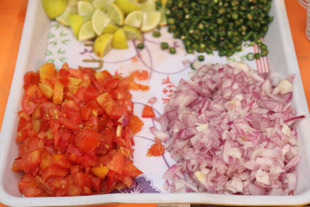 raw minced onion , tomato lemon , and green chili with vegetablesの写真素材