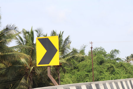 Traffic sign  or Retro Reflection on the road in the city with coconut tree Coimbatore