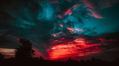 colorful dramatic sky with cloud at sunset. panoramic view