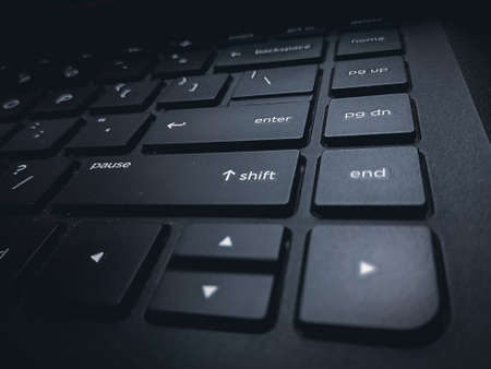 Close up of a black laptop keyboard. Selective focus on the keys.の写真素材