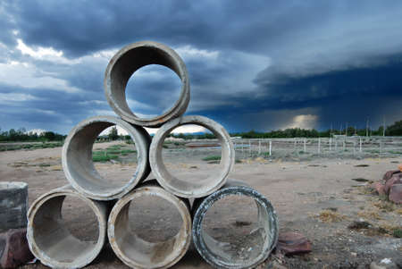 landscape of cultivate land with dark cloudsの写真素材