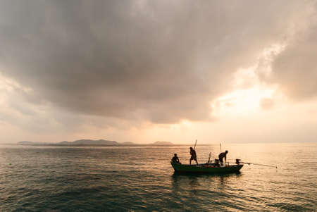 Fisher boat on sunsetの写真素材