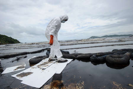 crude oil on oil spill accident on Ao Prao Beach at Samet island on July 31,2013 in Rayong,Thailandのeditorial素材