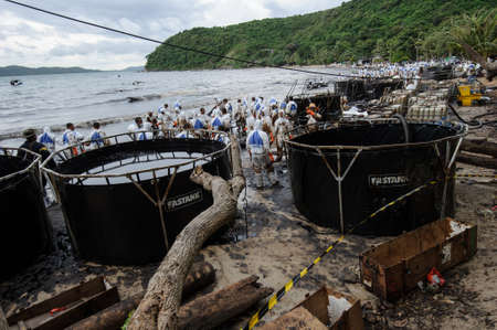crude oil on oil spill accident on Ao Prao Beach at Samet island on July 31,2013 in Rayong,Thailandのeditorial素材