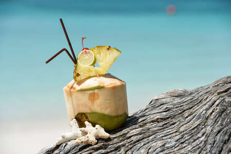 Coconut with drinking  at the seaの写真素材
