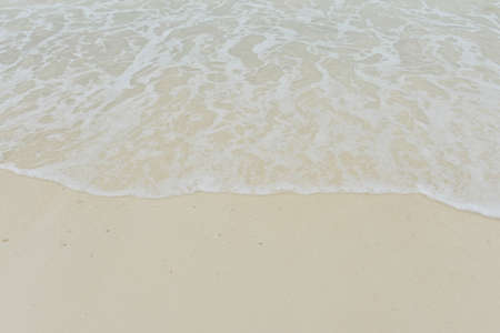 Sea wave over sandの写真素材