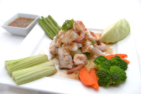fried king prawns and squid with garlic and herbsの写真素材