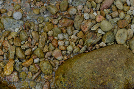 Sea beach. Natural small pebbles on the seashore