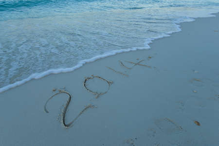 inscription 2014 on sea sand beachの写真素材