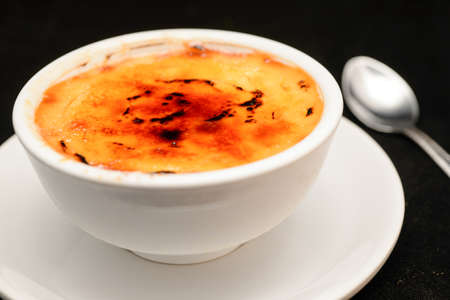 Delicious baked egg custard, topped with nutmeg. A healthy, homely dessert.の写真素材