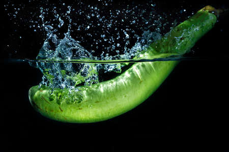 eggplant dropping in fresh waterの写真素材