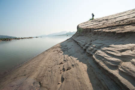 Sand dunes of Khong river and water plant.の写真素材